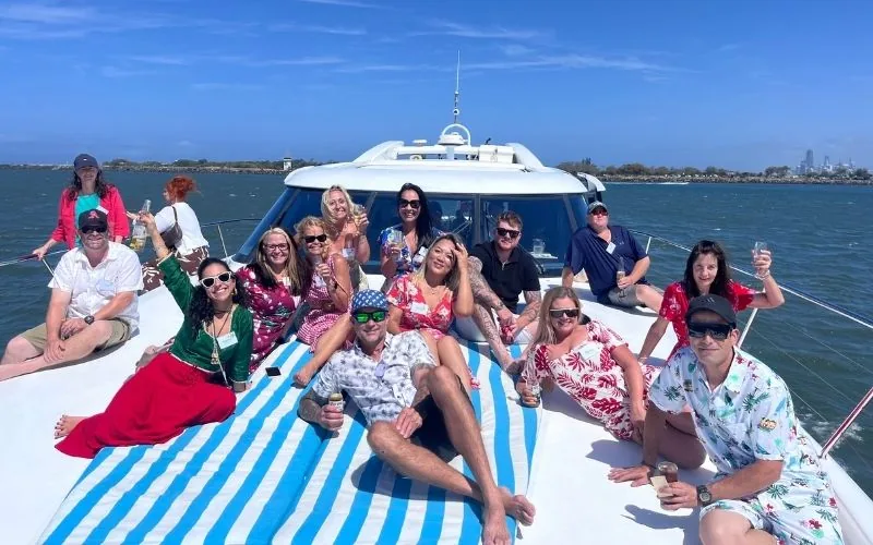 The Your Helpers team together on a boat outing on the Gold Coast.